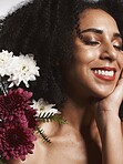 Wellness, flowers and beauty aesthetic model with skincare satisfaction and glowing texture routine. Aesthetic, health and makeup of black woman cosmetics model with beautiful smile in white studio

