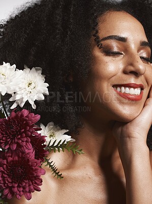 Buy stock photo Wellness, flowers and beauty aesthetic model with skincare satisfaction and glowing texture routine. Aesthetic, health and makeup of black woman cosmetics model with beautiful smile in white studio

