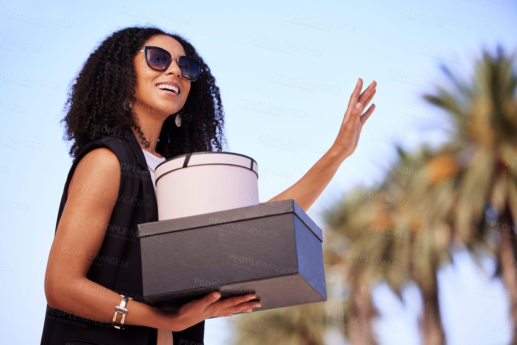 Buy stock photo Black woman, shopping and gifts with smile waiting for lift, pickup or travel with fashion clothing in Miami. Happy African American female shopper smiling in happiness for purchase, sale or discount