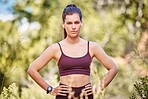 Fitness, exercise and portrait of woman in forest ready for running, marathon training and workout outdoors. Sports, motivation and serious girl with focus for wellness, cardio and healthy lifestyle