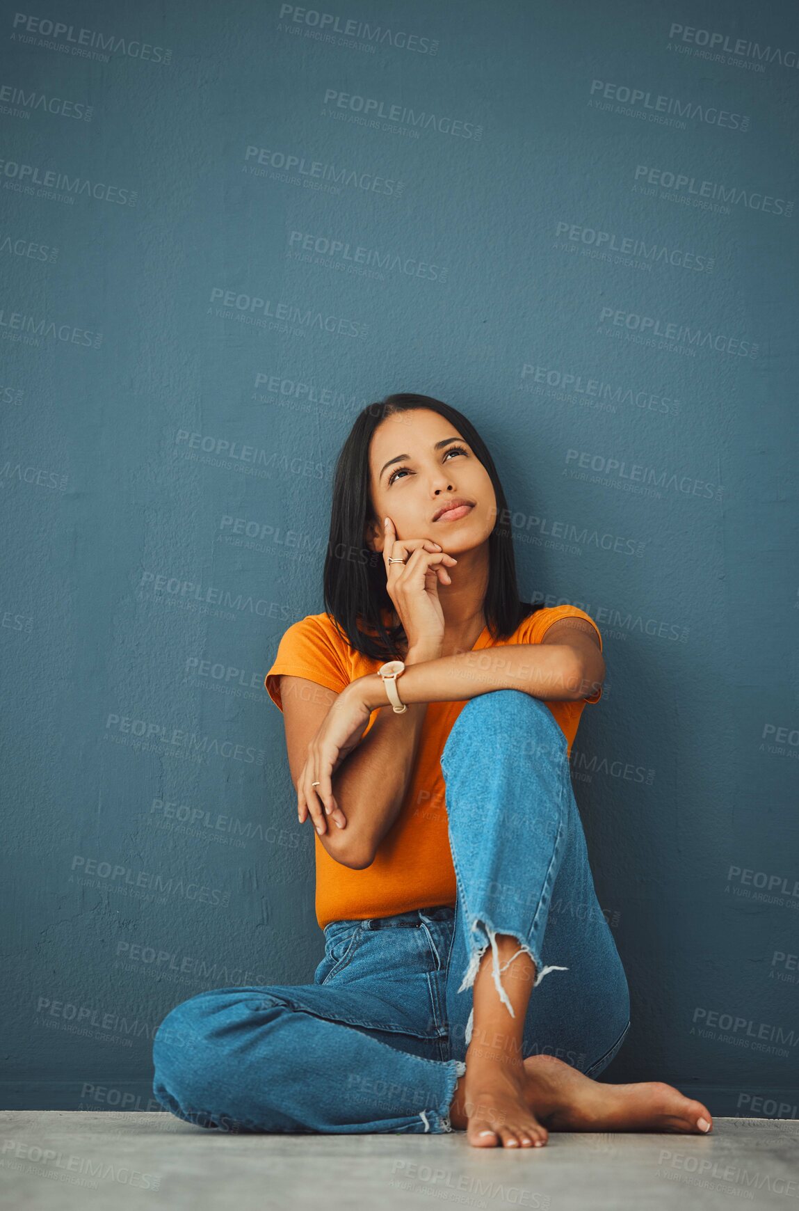 Buy stock photo Woman on ground, thinking and decision for opportunity, ideas and girl daydreaming on blue studio background. Female with imagination, lady on floor and wondering with focus, mindset and thoughts