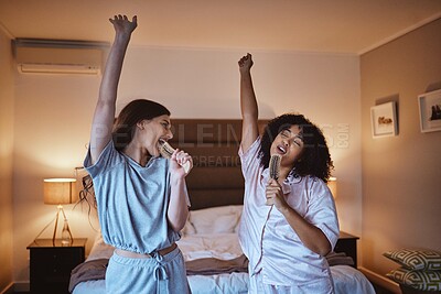 Buy stock photo Friends, singing with brush and women in pajamas to get ready for girls night out dancing, fun music concert and happiness. Girl, friend and happy smile, girlfriends karaoke at sleepover in bedroom.