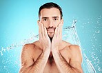 Water splash, facial and portrait of man with skincare on face and morning detox routine isolated on blue background. Hygiene, male model hands and grooming for health, wellness and beauty in studio.