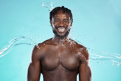 Buy stock photo Water splash, studio and black man isolated on blue background with face cleaning, body and skincare beauty. Strong, muscle and happy model or person in shower aesthetic, wash and dermatology hygiene