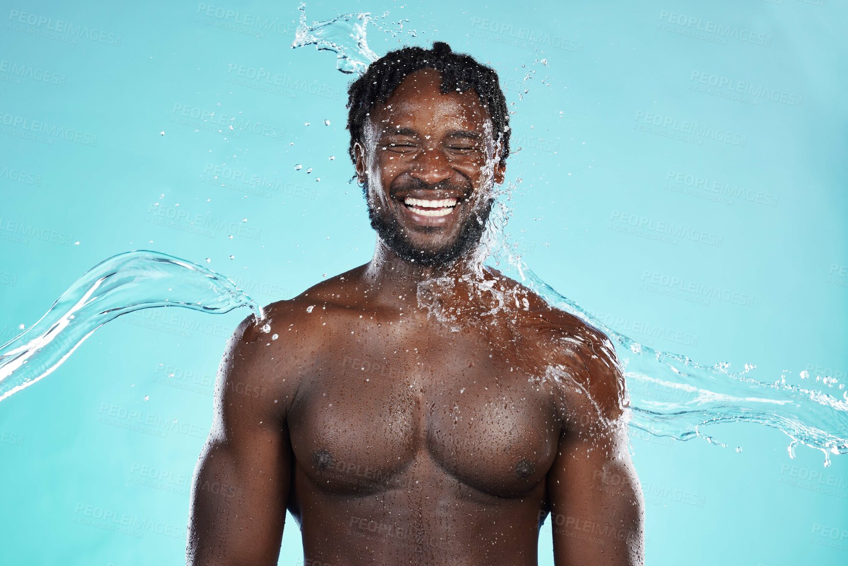 Buy stock photo Water splash, studio and black man isolated on blue background with face cleaning, body and skincare beauty. Strong, muscle and happy model or person in shower aesthetic, wash and dermatology hygiene