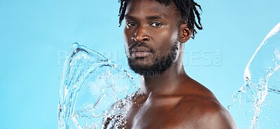 Buy stock photo Banner, shower and portrait of a black man with a water splash isolated on a blue background. Cleaning, beauty and African model for grooming treatment, hygiene and care of body on a studio backdrop