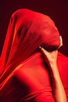Model, red fabric and hide face for fashion, aesthetic and beauty with dark studio background. Gen z woman, cloth  or silk veil for creativity, vision and art with retro, vintage or creative clothes