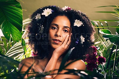 Buy stock photo Beauty, flowers and portrait of woman in studio for wellness, skincare and creative advertising in jungle. Face, skin and girl model relax in zen, peace and product from nature, forest and aesthetic
