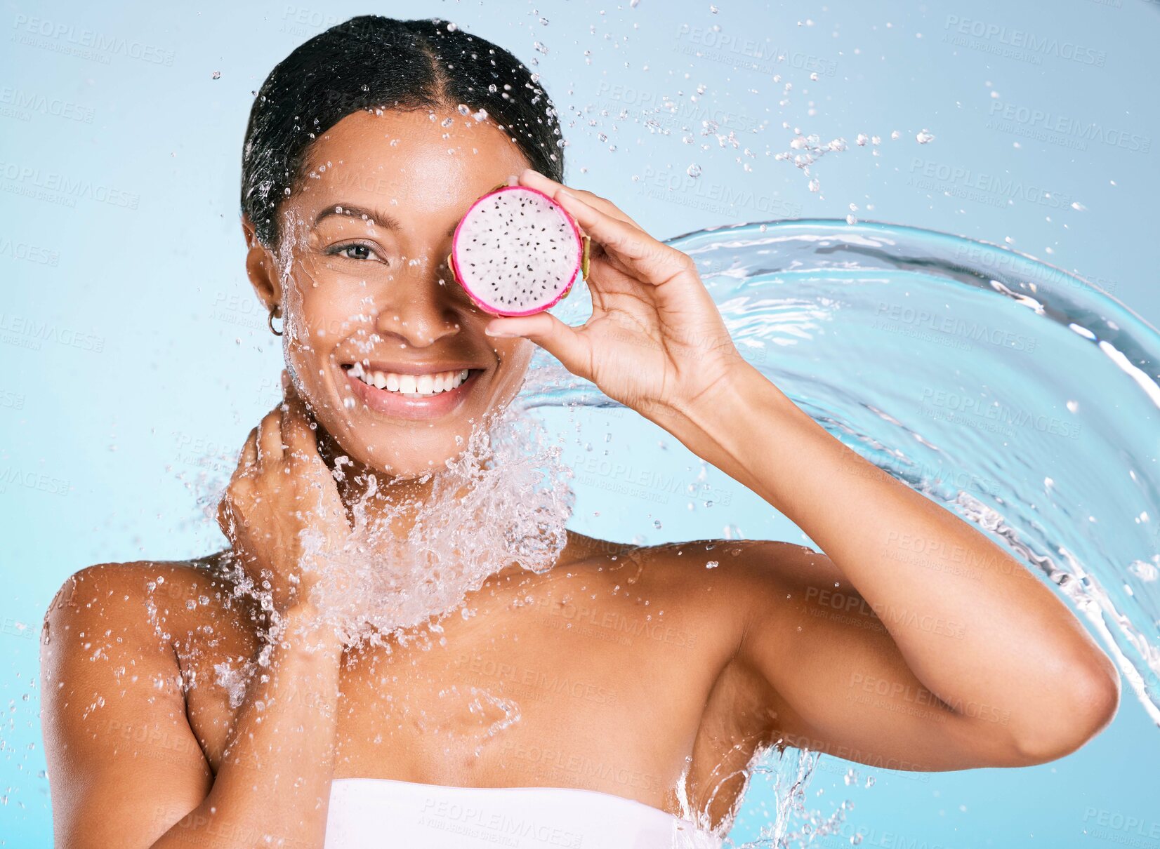 Buy stock photo Dragon fruit, beauty and skin care woman portrait for healthy skin and diet on a blue background. Face of aesthetic model person with water splash and food for sustainable facial health and wellness