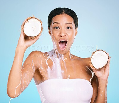 Buy stock photo Beauty, wow and woman portrait with a coconut for healthy skin and diet on a blue background. Face of shocked model person with milk splash and fruit for sustainable facial health and wellness