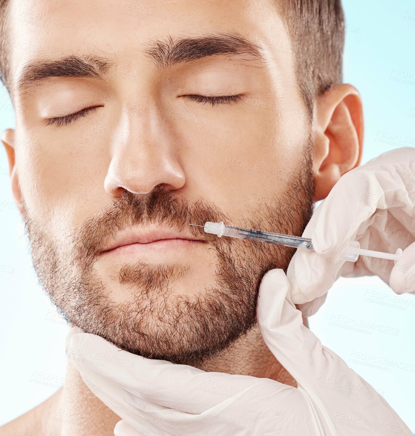 Buy stock photo Man, lip filler and mesotherapy with face, hands and needle syringe, injection and beauty on blue background. Dermatology, cosmetic care and procedure, health and skincare with wellness and collagen