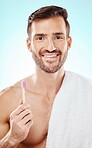 Smile, portrait or man brushing teeth with dental toothpaste for healthy oral hygiene grooming in studio. Eco friendly, smile or happy male model cleaning mouth with a natural bamboo wood toothbrush 