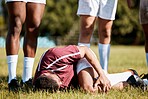 Knee pain, sports with injury and bandage on athlete outdoor, rugby and fitness with man, team and first aid. Medical emergency, wound and sports accident, training and exercise with help and injured