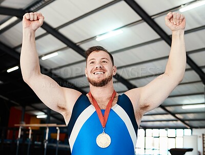 Buy stock photo Man, medal celebration and winner with smile, indoor sports or hands in air at competition with pride. Champion athlete, happy and winning with gold, celebrate or success in global gymnastics contest