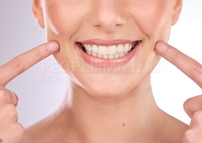 Buy stock photo Mouth, dental and oral hygiene with a model woman in studio on a gray background for teeth whitening. Dentist, healthcare and veneers with a female indoor to show a happy smile at a tooth specialist