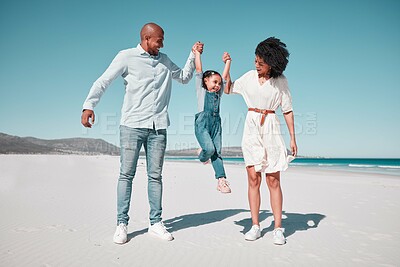 Buy stock photo Father, mother and daughter with swing at beach, holding hands and support for funny game with smile. Happy family, ocean and vacation with man, woman and girl for freedom, sunshine or bond with love