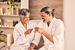 Spa, champagne and happy couple toast in massage, vacation or holiday celebration, love and romance. Wine glasses, excited or senior people in luxury, wellness and relax, hospitality service or hotel