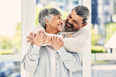 Buy stock photo Hug, marriage and senior couple with love, smile and retirement with happiness, home and bonding. Old woman, happy mature man and embrace in a lounge, loving together and romance with a relationship