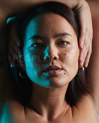 Buy stock photo Neon, beauty and studio portrait of Asian woman with natural cosmetics, shadow or blue skincare light, glow or shine. Creative lighting, self love or face of person with makeup on dark background