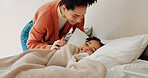 Morning, care and a mother and child in the bedroom to wake up, bonding and laughing together. Happy, family and a young mom with love, relaxing and comfort with a girl kid in bed in a house