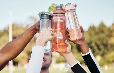 Buy stock photo Hands, water bottle and cheers for team sports exercise, fitness or training outdoor on grass field. Diversity sports people, healthy cardio workout and goals in sun as athlete, motivation or support