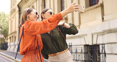 Buy stock photo Selfie of women in city together with smile, nature and memory on social media with sunglasses. Photography, happiness and friends on urban travel for holiday blog, post or live stream on street walk