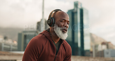 Buy stock photo Man, headphones and tired from exercise, city and challenge in outdoor fitness, fatigue and dehydrated. Black mature person, exhausted and workout in retirement, listen and streaming radio or podcast