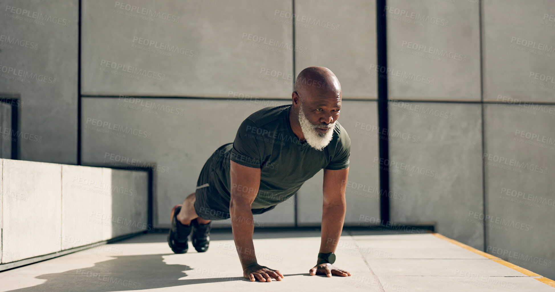 Buy stock photo Mature, man and fitness for exercise with pushup for strength, health or wellness by outside. African person, alone and training near stairs for workout with endurance, concentration and dedication