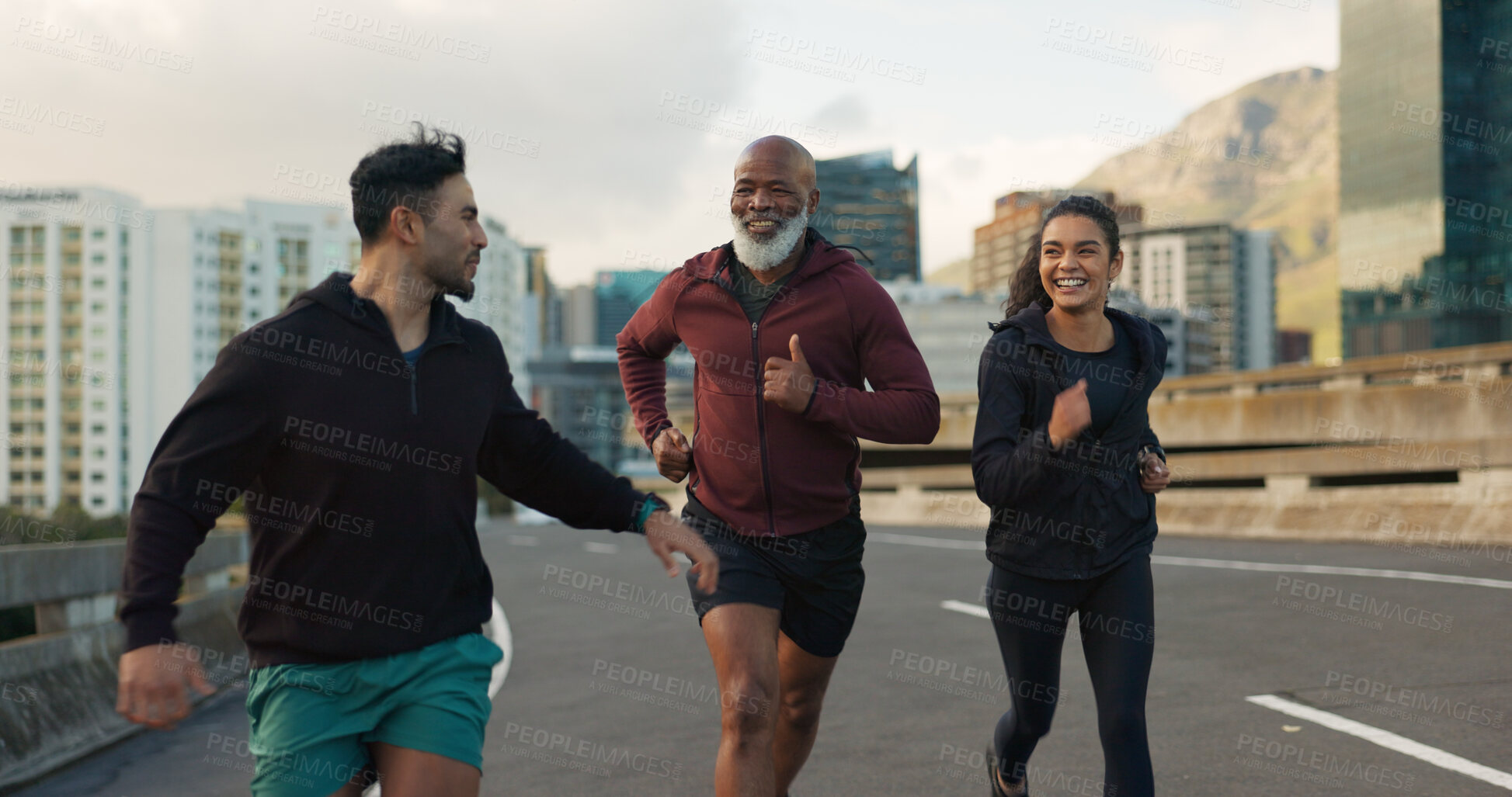 Buy stock photo Runner group, friends and city on road with talking, progress and happy for fitness, health and wellness. Men, woman and conversation on metro street for workout, training and exercise in Cape Town