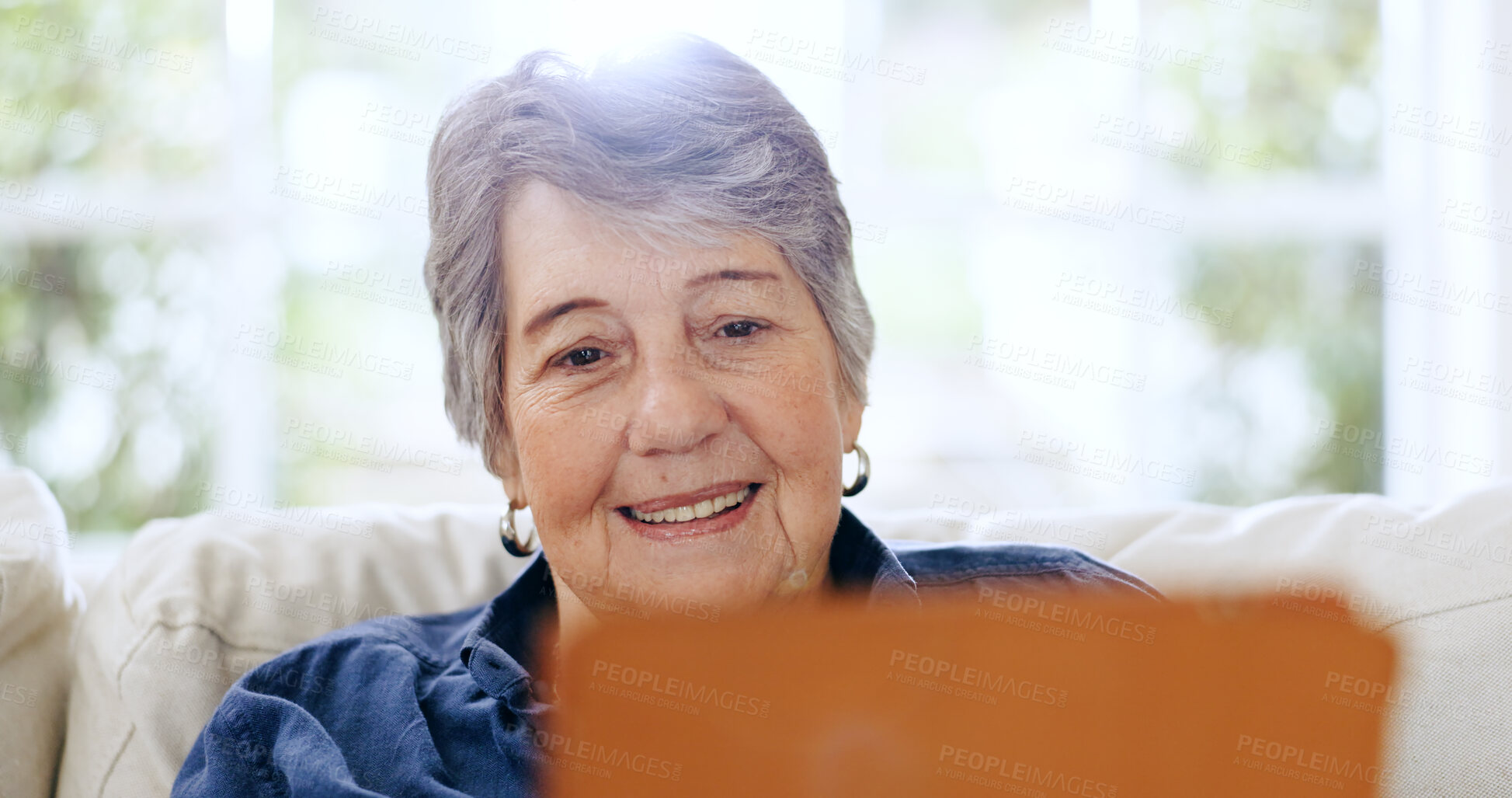 Buy stock photo Senior, woman and tablet with smile on sofa for video call, communication or reading email with internet in living room. Elderly, person and touchscreen on couch with happiness for streaming or web