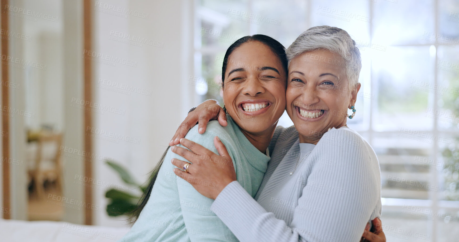 Buy stock photo Hug, happy and portrait of mother and daughter in home for bonding, relationship and smile together. Family, love and mature mom embrace adult woman for mothers day, support and care in living room