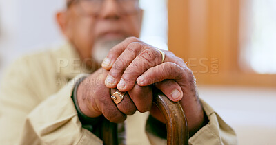 Buy stock photo Hands, walking stick and a senior person with a disability in the living room of a home closeup for retirement. Balance, retirement and wellness with an elderly adult holding a cane for support