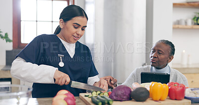 Buy stock photo Caregiver, cooking and senior woman in home with healthy food, vegetables and nutrition in healthcare. Retirement, nurse and helping elderly person in kitchen with diet and online recipe on tablet