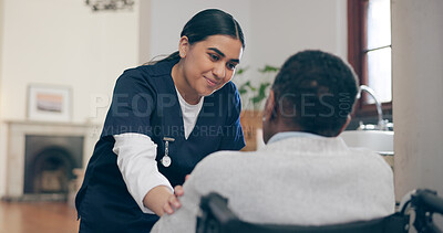 Buy stock photo Consultation, healthcare and nurse with patient in a wheelchair for discussion at nursing home. Medical career, conversation and young female caregiver talking to woman with disability in her house.