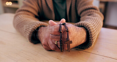 Buy stock photo Hands, rosary and cross with closeup for faith, peace and hope at desk, home or praying for worship. Person, crucifix and jewelry for religion, mindfulness and connection to holy spirit, Jesus or God