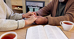 Bible study, senior couple and holding hands for praying, religion and closeup in home for mindfulness. Elderly person, book and hope for peace, gratitude or connection to God, holy spirit or faith