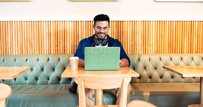 Happy man in cafe, typing on laptop and remote work, reading email or writing blog, article or search on tech. Computer, freelancer and editor in coffee shop, store or restaurant for project at table
