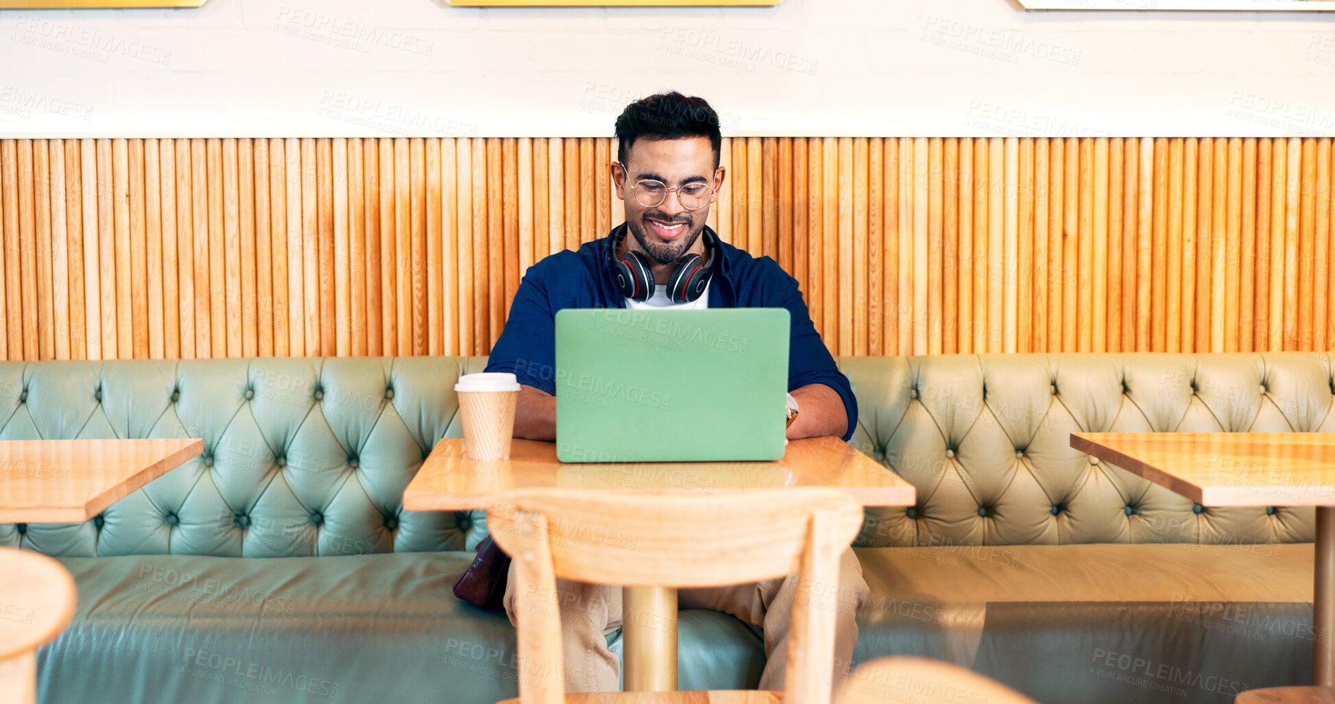 Buy stock photo Happy man in cafe, typing on laptop and remote work, reading email or writing blog, article or search on tech. Computer, freelancer and editor in coffee shop, store or restaurant for project at table