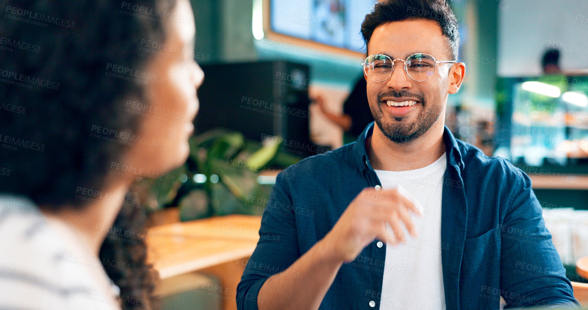 Buy stock photo Happy man, glasses and smile on date in coffee shop for food, lunch or snack. Mexican person, laugh and funny joke with girlfriend in restaurant, bistro or cafe for bond, together and relationship