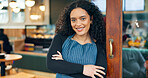 Small business, cafe and arms crossed with smile, waitress and startup for coffee shop, door and restaurant. Portrait, woman and entrance for retail, proud and confident at store, happiness and open