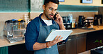 Waiter, phone call and tablet for restaurant communication, online management or customer service in cafe. Small business owner, barista or cashier man on mobile and digital tech for coffee shop data