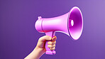 Hand holding purple megaphone. Marketing, sales and promotion announcement.