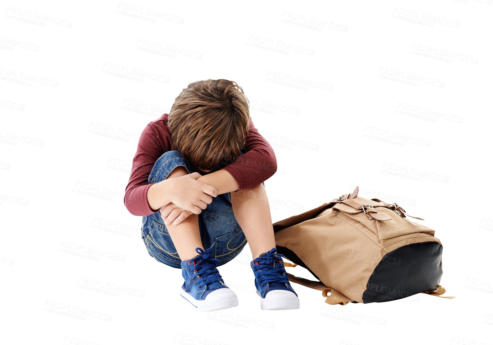 Buy stock photo Sad boy, school bag and depression in anxiety, mental health or lonely isolated on a transparent PNG background. Little child or kid sitting on floor in stress, mistake or loneliness with backpack