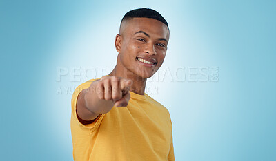 Buy stock photo Man, portrait and pointing to you in studio for choice, vote for winner and decision to volunteer on blue background. Happy model show finger for recruitment, hiring emoji and invitation to join us 