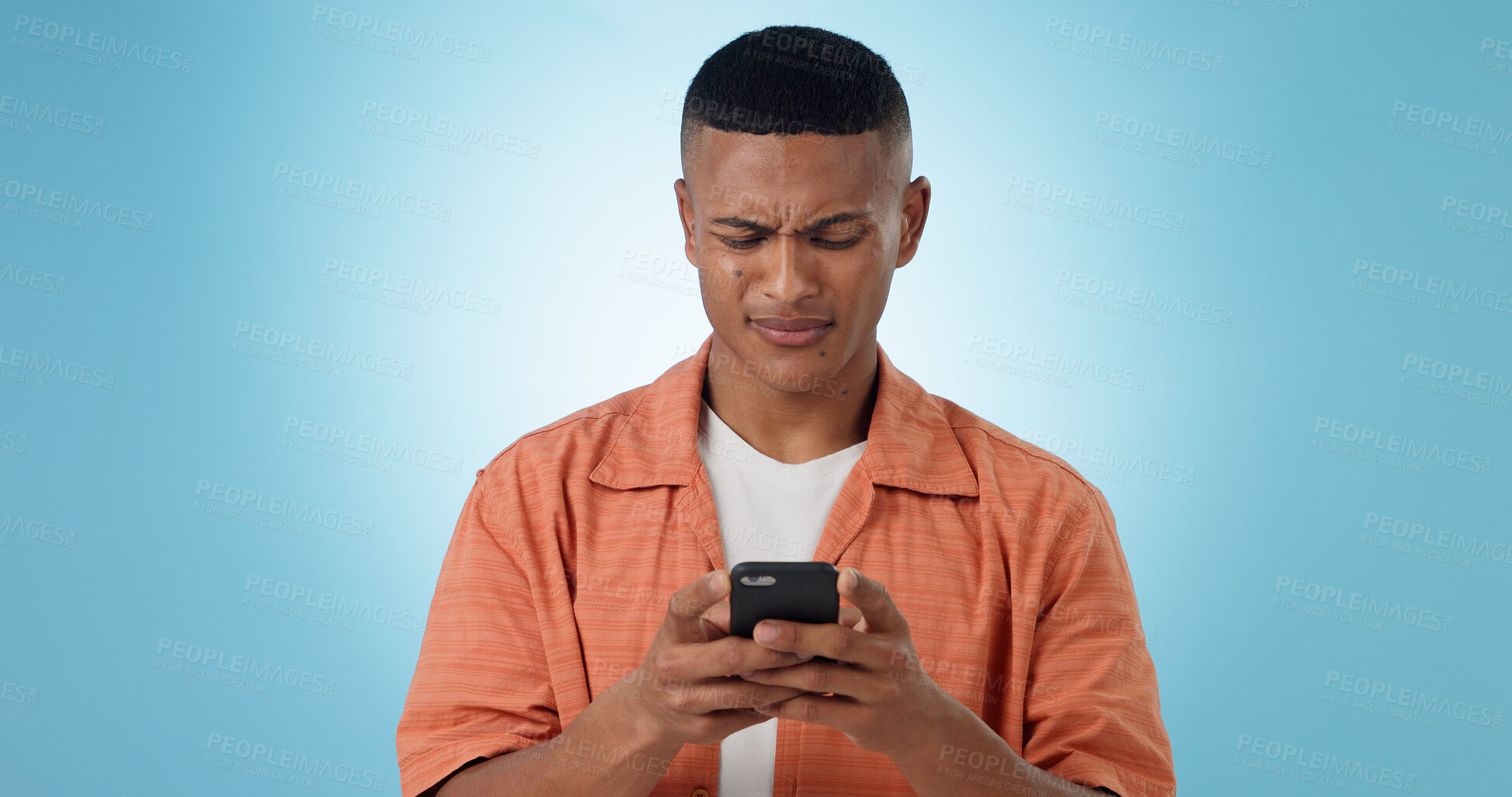 Buy stock photo Doubt, confused and man with cellphone, typing and connection with digital app on blue background. Person, guy and model with smartphone, mobile user or reaction with expression, error 404 or contact