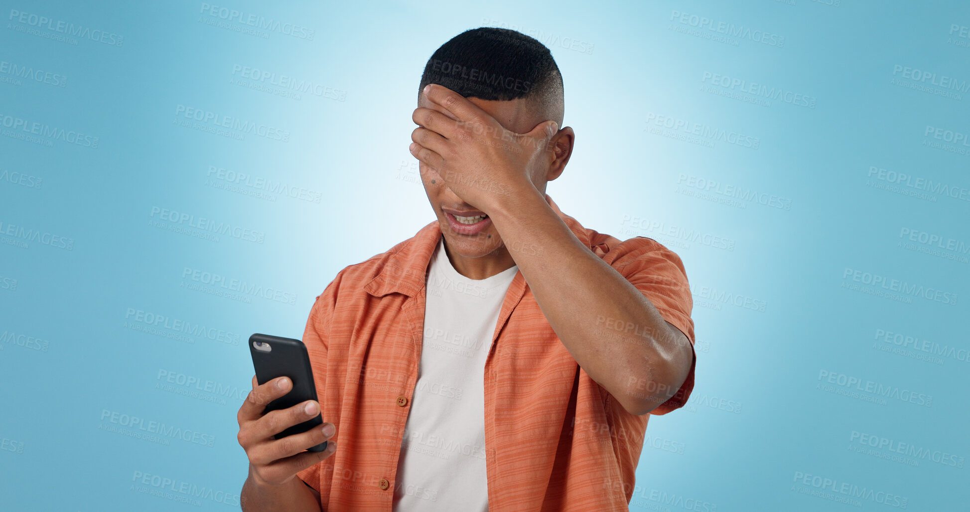 Buy stock photo Man, phone and shock for bad news in studio for negative text message, disappointment or loss. Male person, mobile and connection or social media for unhappy discussion, blue background as mockup