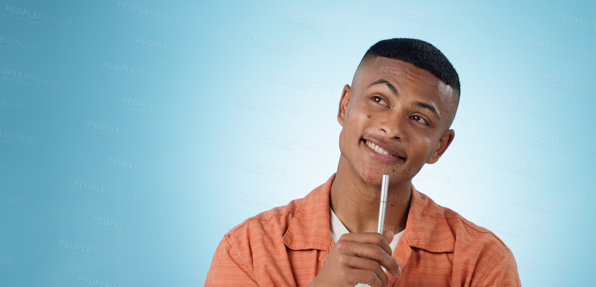 Buy stock photo Thinking, pen and man in studio with idea, solution or problem solving on blue background space. Questions, face or male university student with brainstorming emoji for solution, answer or conclusion