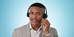 Call center, man and portrait in studio for customer service, CRM questions and IT support on blue background. Face of telemarketing salesman, virtual consultant and microphone for telecom advisory 