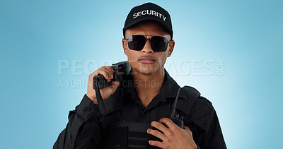 Buy stock photo Portrait, security guard and serious man in sunglasses, safety protection service or law enforcement. Face, cop and police officer for justice, danger or crime in studio isolated on a blue background