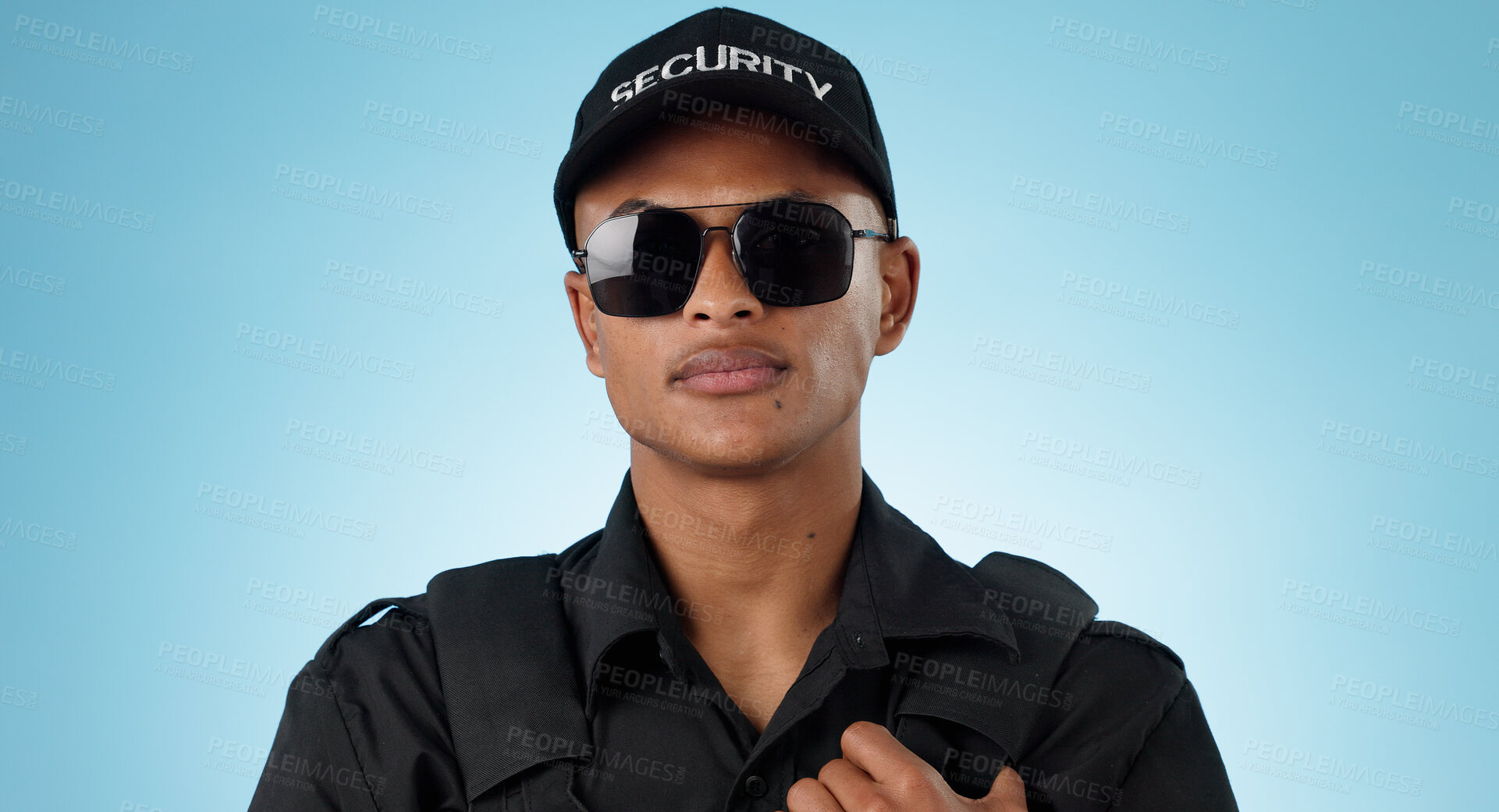 Buy stock photo Security guard, portrait and man in studio with glasses for surveillance, justice and law enforcement on blue background. Serious bodyguard for crime prevention, safety patrol and monitoring danger 